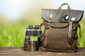 Vintage backpack, hiking mug, watches and binoculars. Traveling accessories for travel, traveling,...