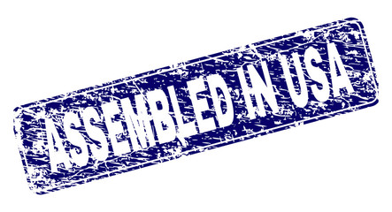 ASSEMBLED IN USA stamp seal print with grunge style. Seal shape is a rounded rectangle with frame. Blue vector rubber print of ASSEMBLED IN USA title with scratched style.