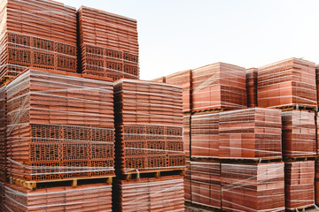 Brick pallets ready to build buildings by bricklayers.