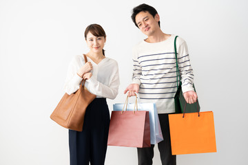 young asian couple shopping image on white background