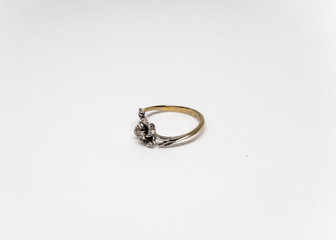 Ring with stones white gold gray background