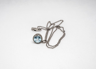 White gold chain with blue stone