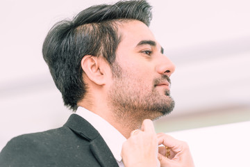 Fototapeta premium Groom man dressing suit in wedding ceremony Head shot Close-up