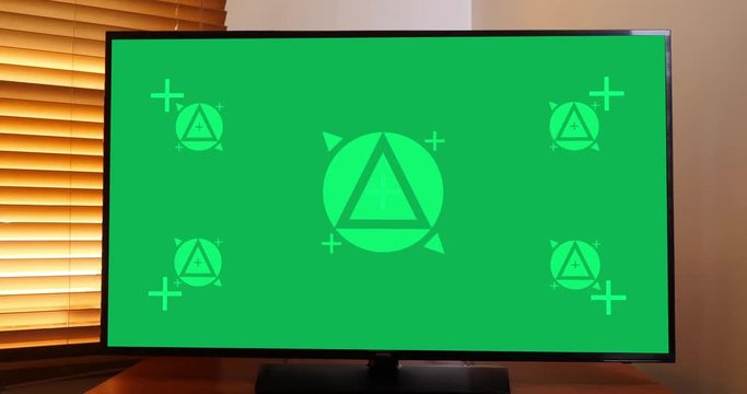 A slow dolly shot of a typical home flatscreen television. Green screen with optional tracking points for screen replacement. Pre-tracked AE comp available upon request.  	