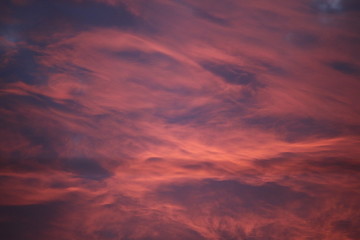 dramatic sky with reddish clouds