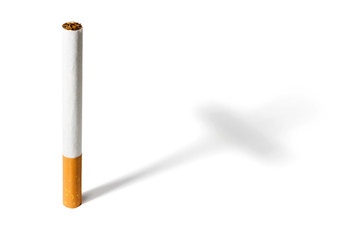 Cigarette isolated on white background casting a cross shaped shadow