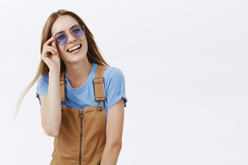 Portrait of stylish and joyful caucasian female student talking enjoying great party laughing...