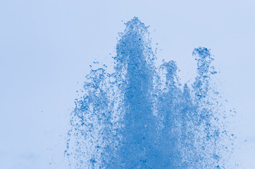 Obraz na płótnie Canvas Closeup of ice-blue water drops in air