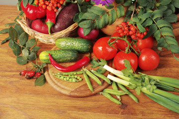 Tomatoes and cucumbers on the kitchen board. Close-up