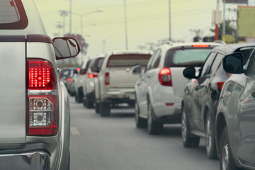 Fototapeta premium Silver pick up car on the road in traffic junction there are many cars on the road.