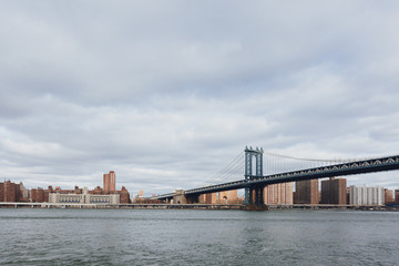 Manhattan skyline viewed from Brooklyn with Manhattan bridge, in New York City, USA