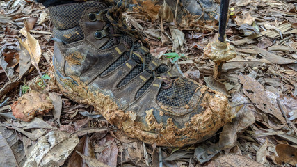 Mud cakes the boot of a hiker.