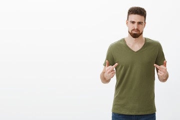 Naklejka premium Know what, fuck you. Portrait of pissed off angry and offended handsome bearded man having fight with best friend, being betrayed pouting from anger showing middle fingers at camera, frowning furious