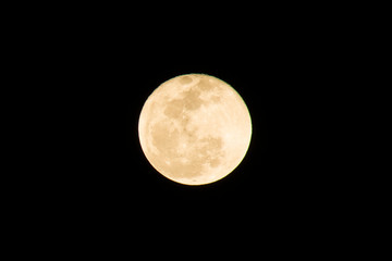 Obraz premium Full moon on the dark night. Moon is an astronomical body that orbits planet Earth and is Earth's only permanent natural satellite