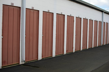 Fototapeta na wymiar Building exterior of a secure self storage facility with multiple drive up units