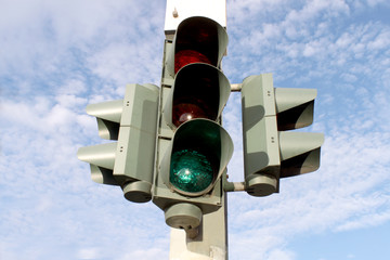 Traffic light on blue sky background
