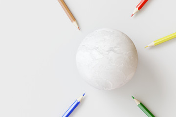 White earth with color pencils on white background. Creative idea concept. 3d rendering