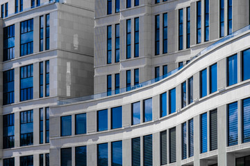 Part of modern building with blue windows closeup. European architecture example