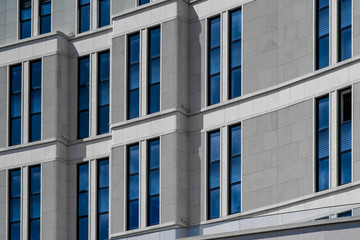 Part of modern building with blue windows closeup. European architecture example