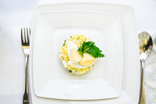 White Bowl Of Deviled Egg Salad On Table