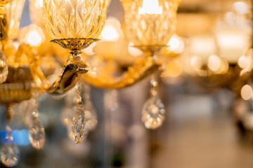 abstract image background of blur bokeh and crystal chandelier light equipment filter tone color effect