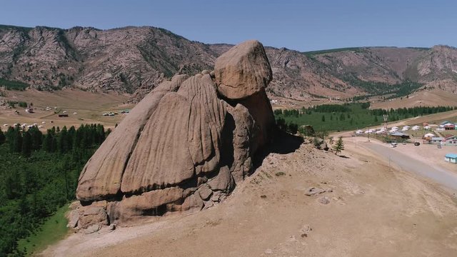 Park Terelj rocks and steppe near Ulaanbaatar Mongolia. Beautiful Mongolian nature. Aerial drone helicopter around unique Turtle main famous rock attraction