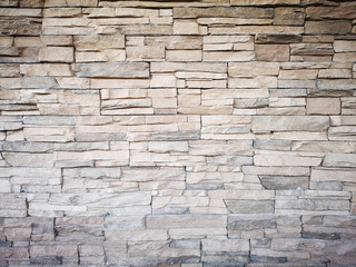 Close up of a grey modern stone brick wall used for background