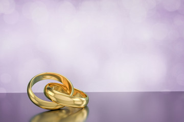 couple of gold wedding rings on bokeh background,3d rendering