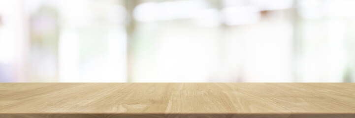 Empty wood table top and blurred restaurant interior banner background - can used for display or montage your products.