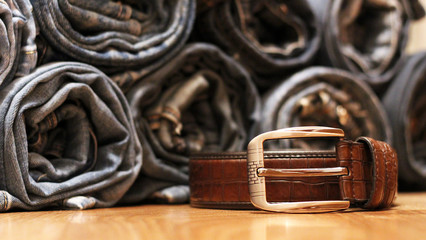 Blue jeans and brown leather belt