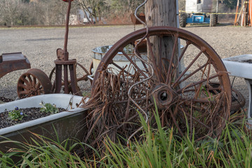 Old rusty wheels thrown by the side of the road in Oregon
