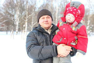 Young family with children in winter