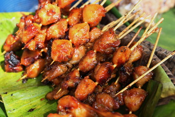 Thai street food. Chicken butt grilled
