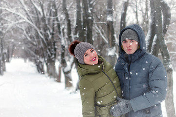 Fototapeta na wymiar family couple walk winter snow