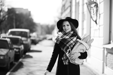 Black and white photo of a young girl on a walk