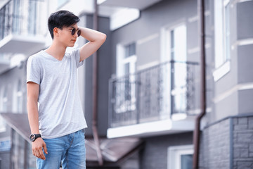 Asian fashion man outdoors in the city
