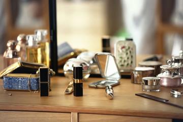 lipsticks and cosmetics on a dressing table