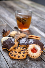 different homemade cookies with cup of tea