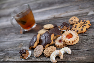 different homemade cookies with cup of tea