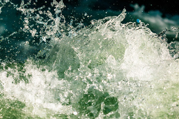 Fototapeta na wymiar Splashes of water from the waves in the sea
