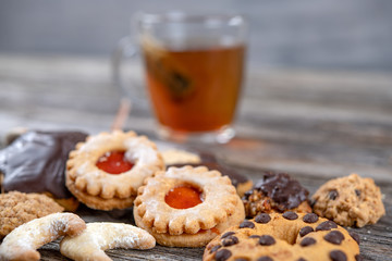 different homemade cookies with cup of tea