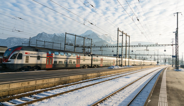 January 4, 2019 - Sargans, SG, Switzerland: train station in Sargans, Switzerland, in winter after clean up work with a modern SBB train departing the station on time