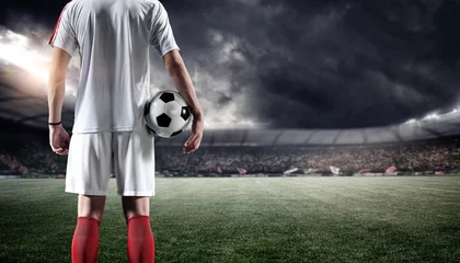 Foto auf Acrylglas Football player with ball in the stadium © efks