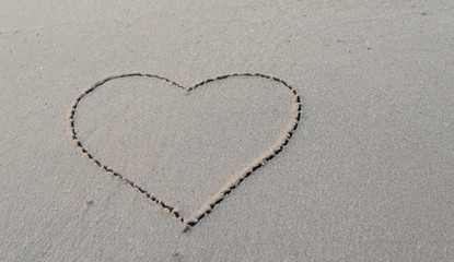 love message written in sand background