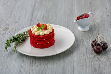 Thai Cake. Velvet red cake. Cookies decorated with red cake on wooden table and flower. strawberries moring. Cherry in the cup. Sweet and Cherry.