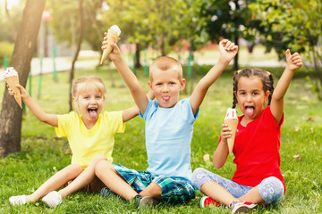 Group of happy little friends having fun at the yard.