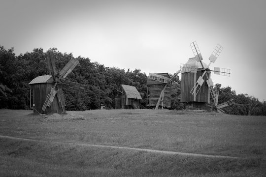 Black and white picture of the old wooden mills in the village