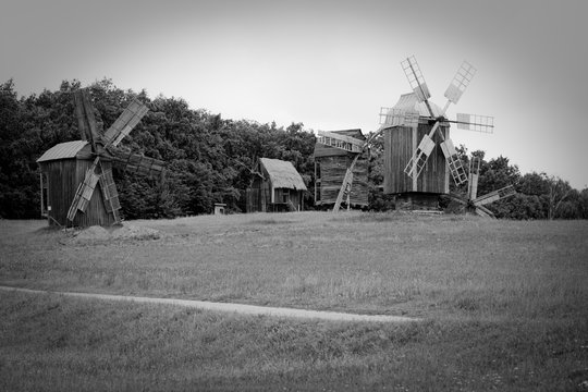 Black and white picture of the old wooden mills in the village
