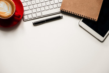 Office stuff with Movie clapper tablet, laptop ,smartphone and coffee cup notepad top view shot.