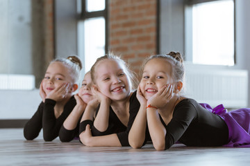 Cute little kids dancers on dance studio. Choreographed dance by a group of small ballerinas...